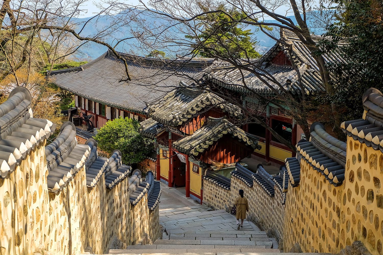 Tourist walk down the stairs in Beomeosa Temple in Busan, South Korea