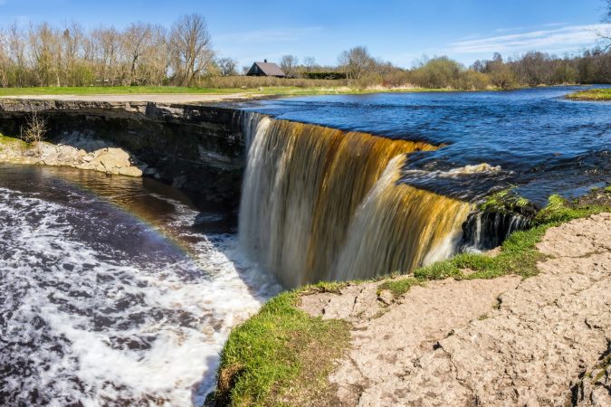 Panoramic view of the famous Jagala( Jägala) waterfall with rainbow in mist, Estonia