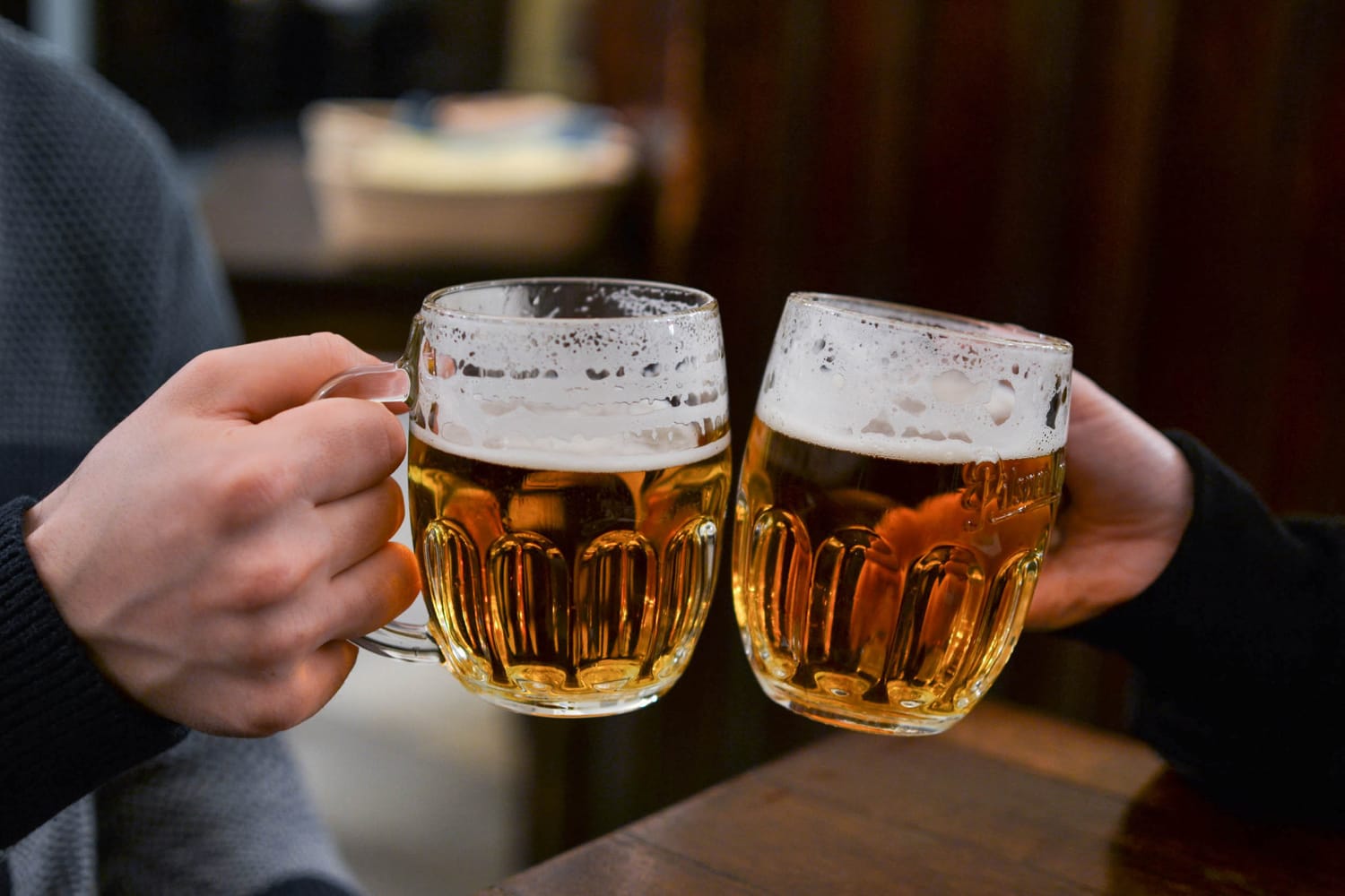 Friends having draught beer in Prague, Czechia