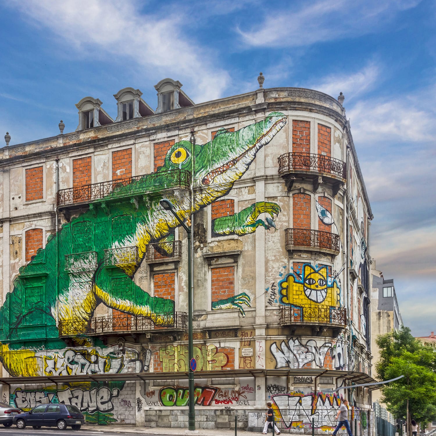 Lisbon street art. graffiti green crocodile. Painting house, Avenida Fontes Pereira de Melo, Lisboa, Portugal.