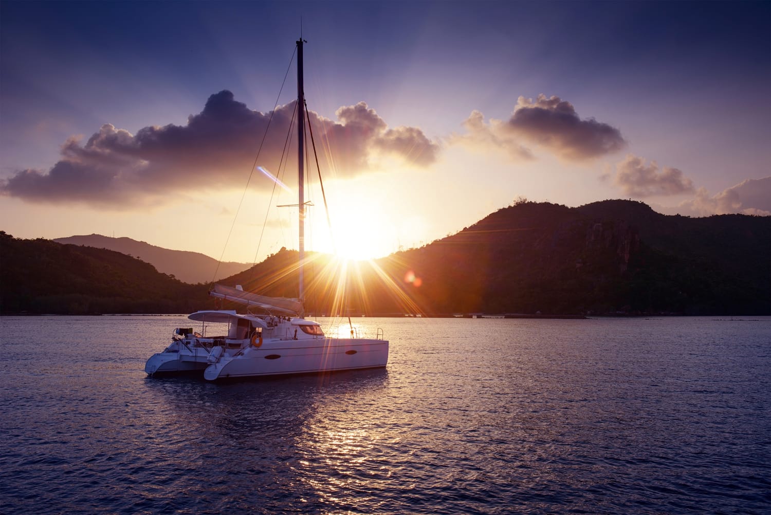 Sunset with catamaran in Santorini, Greece