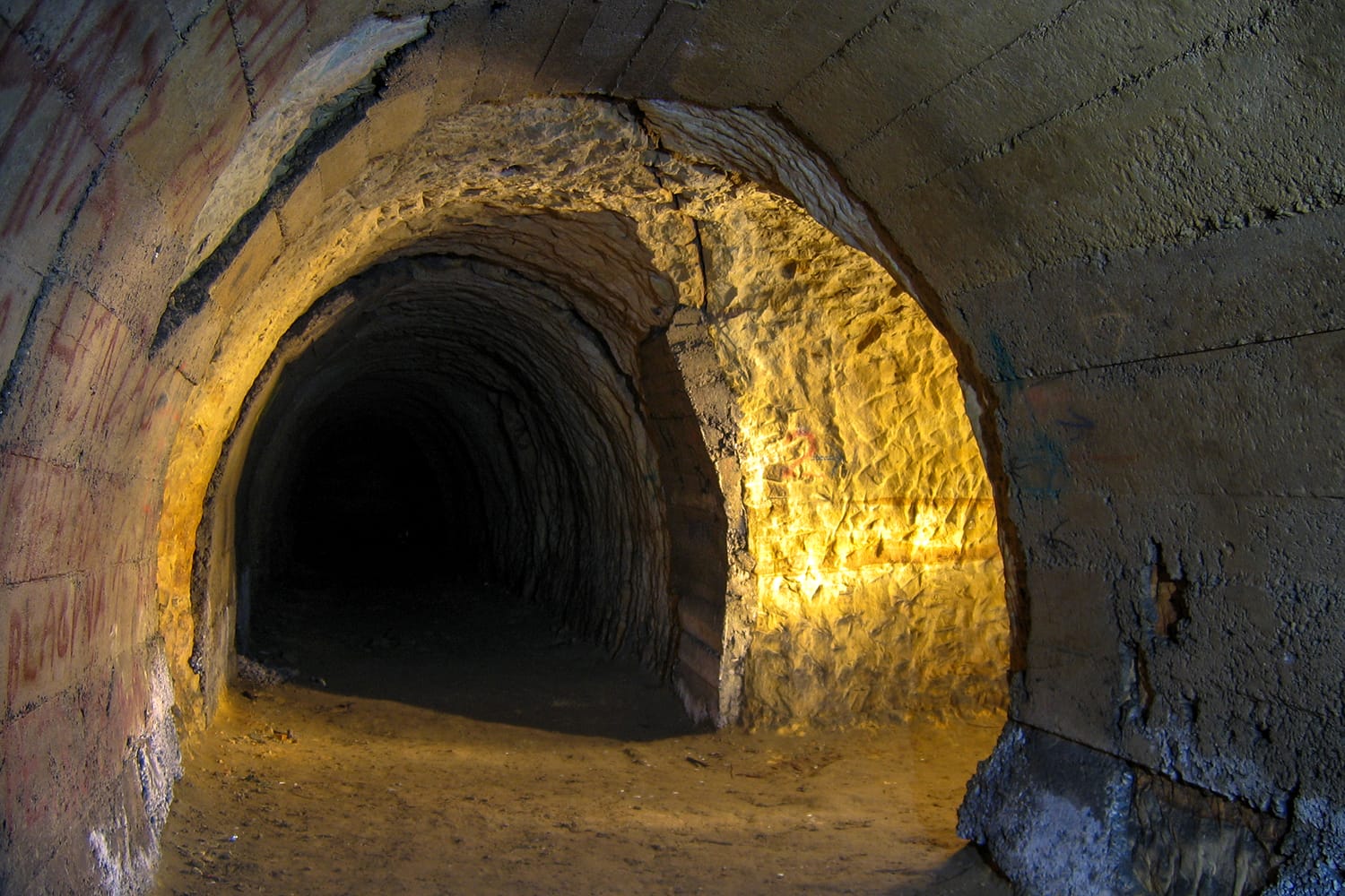 Underground corridor in sandstones with a concrete wall in the area of Divoka Sarka, Prague, Czechia