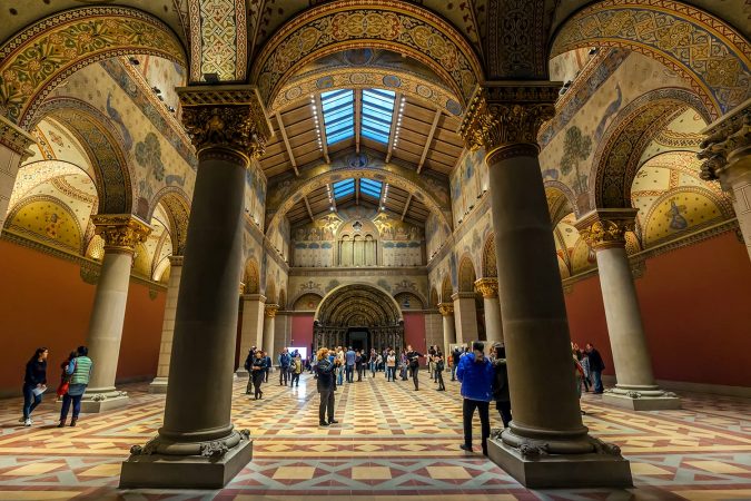 Unidentified people watch the refurbished Romanian hall of the Budapest Fine Arts Museum