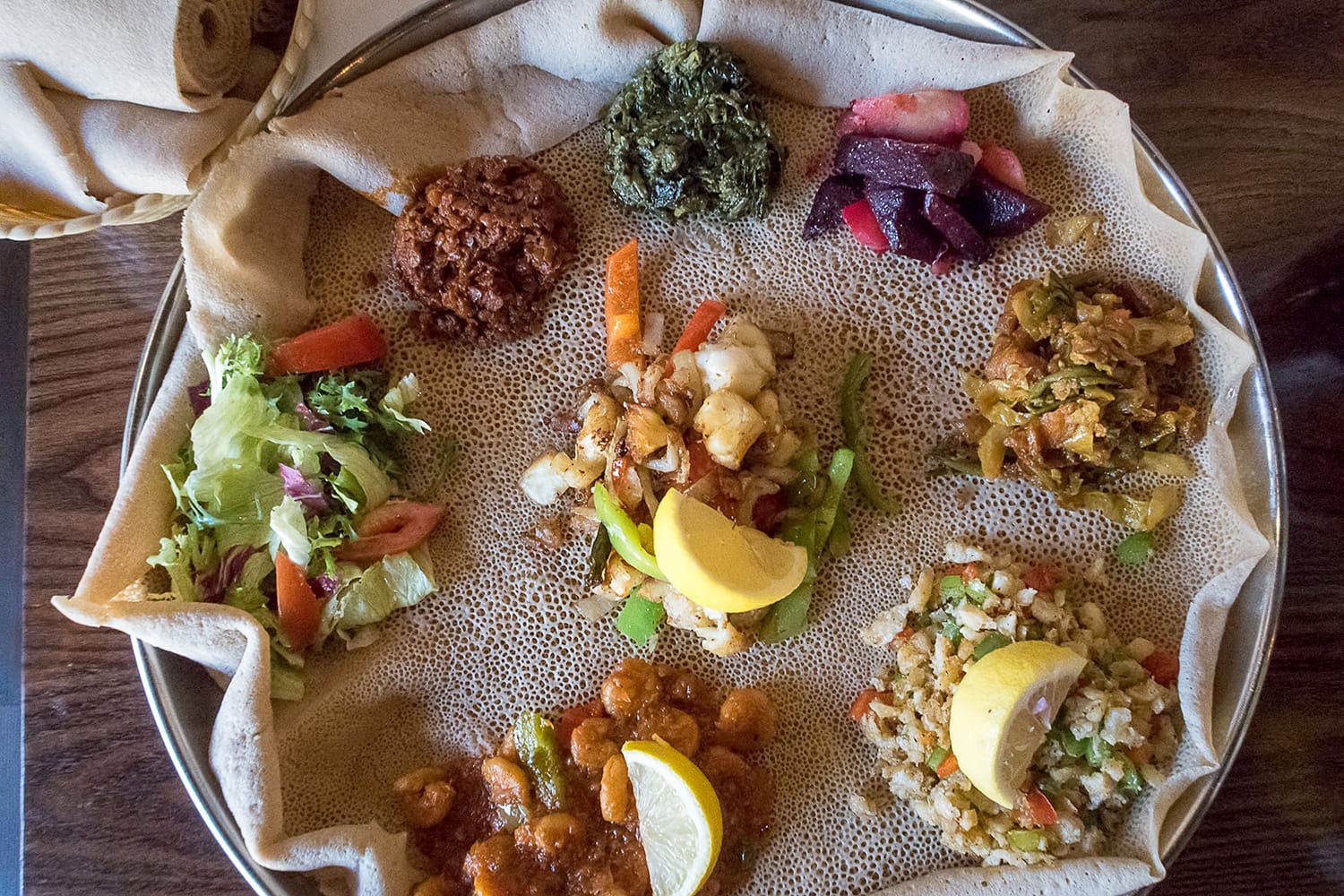 Injera is a sourdough flatbread made from teff flour. It is the national dish of Ethiopia, Eritrea, Somalia and Djibouti