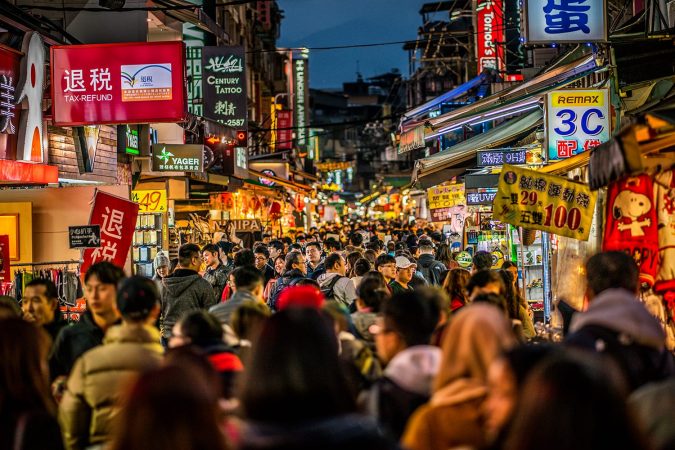 Street view of full of people Shilin night market in Taipei Taiwan