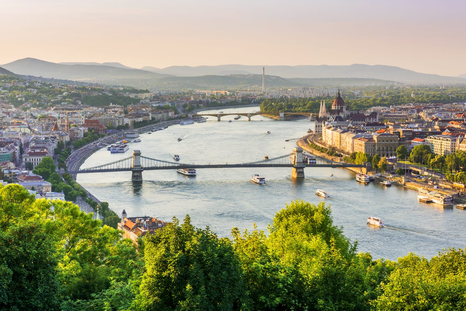Panoramic night view of Budapest from Gellert Hill. Danube River, Chain Bridge, Parliament Building, Buda and Pest views. Budapest, Hungary.