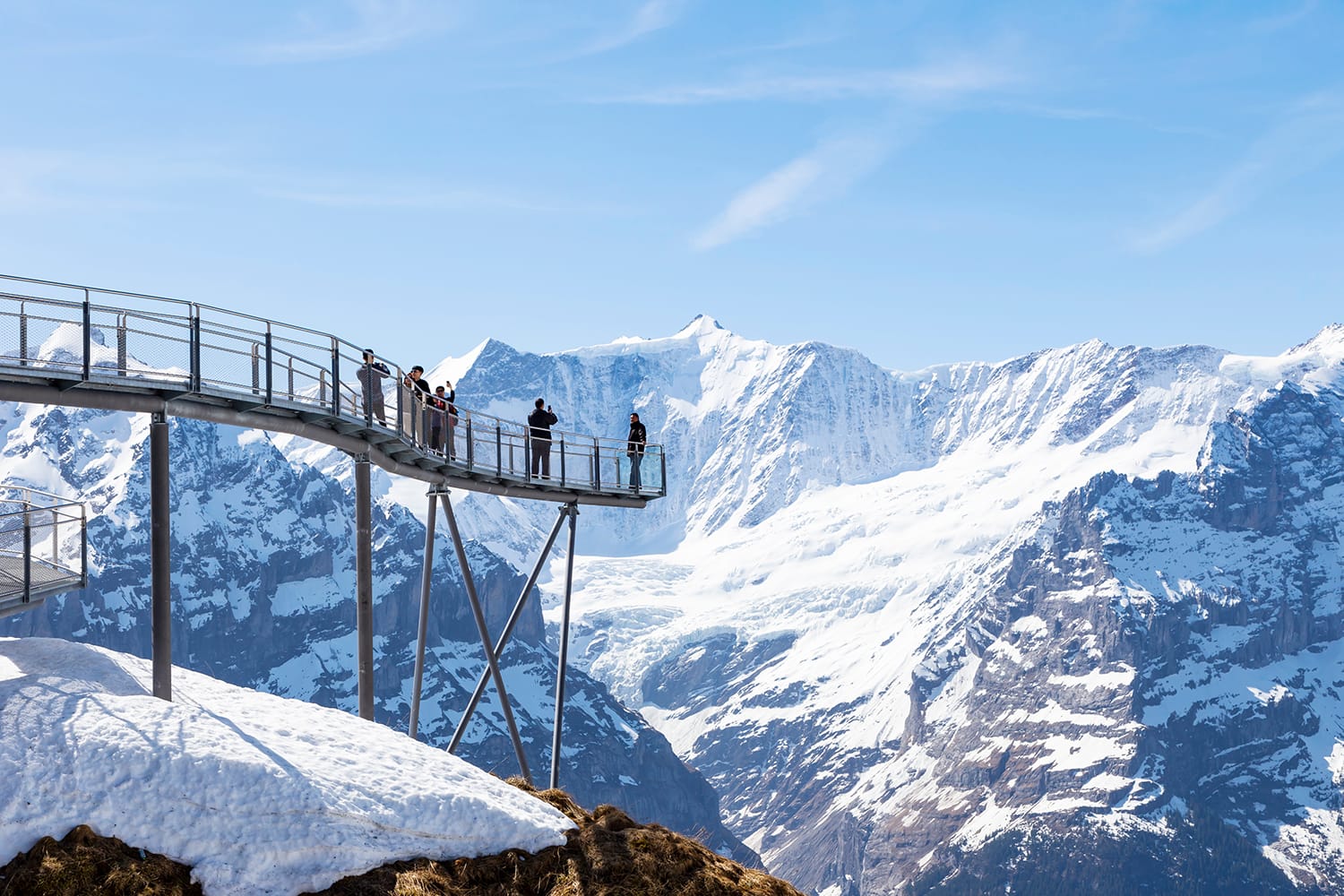 Traveller are resting and photograph on sky cliff walk at First peak of Alps mountain Grindelwald Switzerland