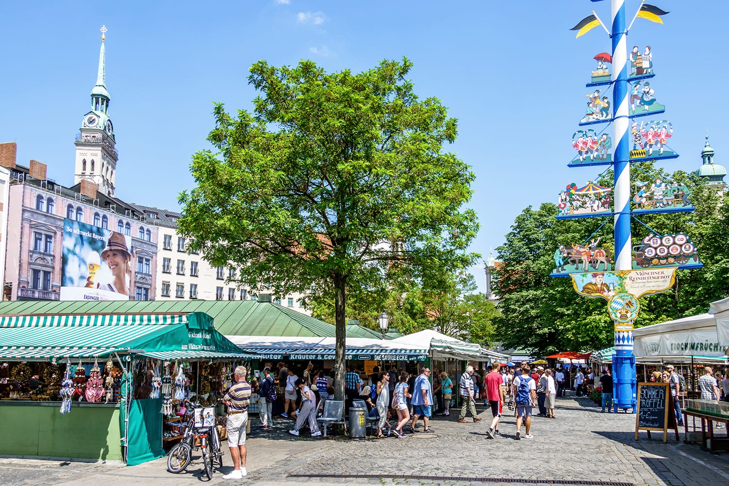 View of Viktualienmarkt a sunny day. It is a daily food market and a square in the center of Munich near Marienplatz