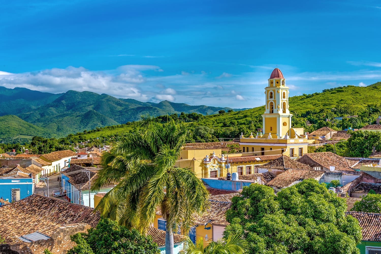 Trinidad de Cuba, panoramic skyline with mountains and colonial houses.
