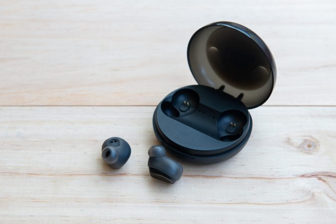 True wireless earbuds on table