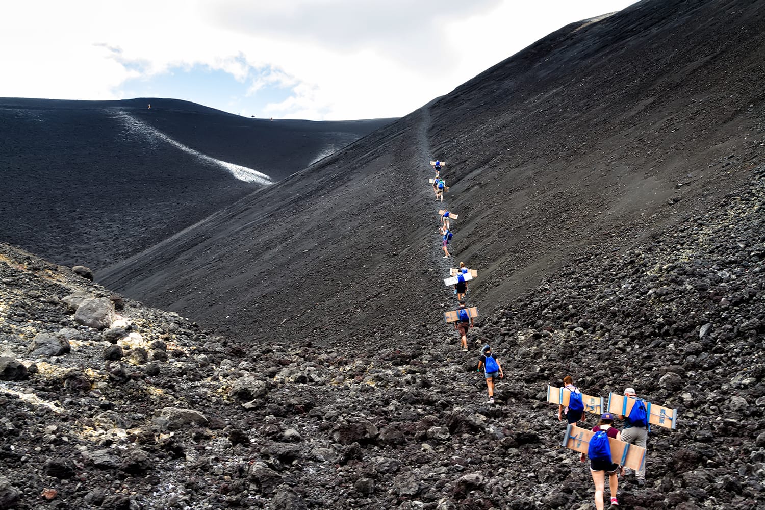 Tourists are ready for volcano boarding from Cerro Negro volcano, Nicaragua