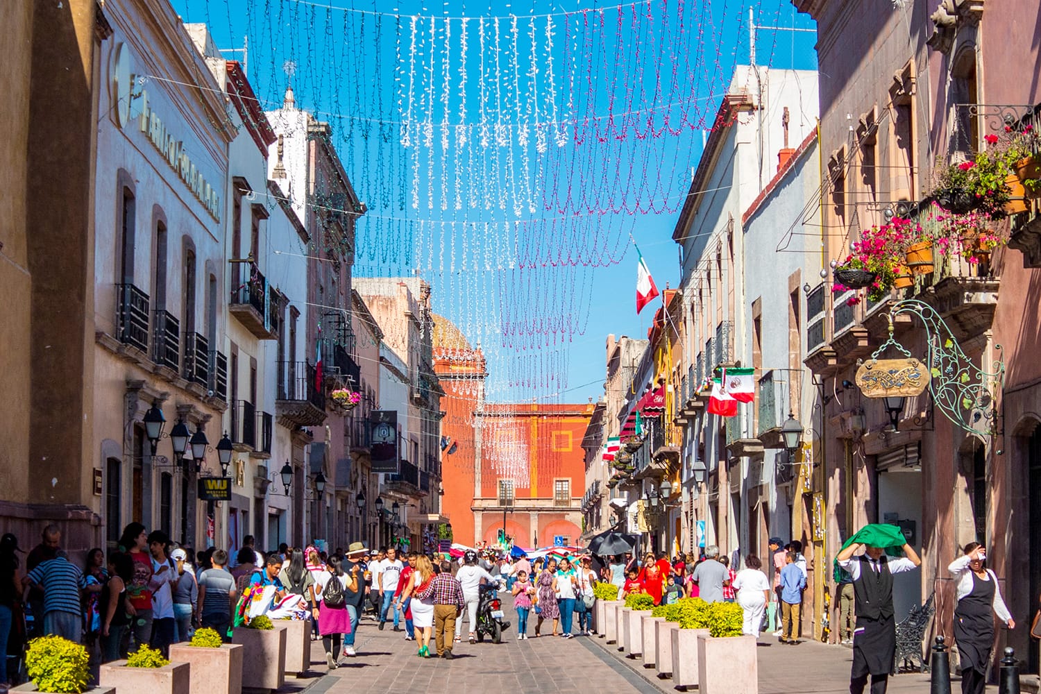 A crowd in Calle Francisco I Madero enjoying the celebration of Independence Day in Queretaro, Mexico.