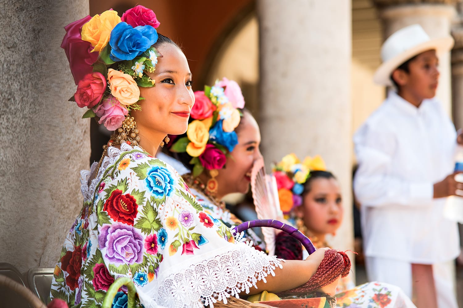 A picture of a young mayan dancer, member of the folkloric ballet of the state of Yucatán. Wearing the typical Yucatán costume