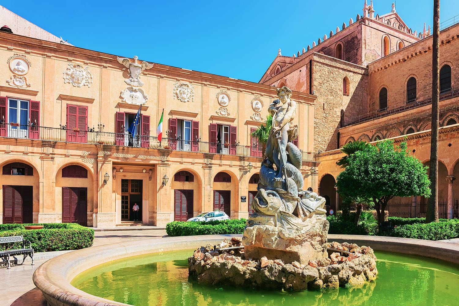 View of Vittorio Emanuele Piazza - Monreale townsquare near majestic Norman Cathedral in Monreale, Sicily, Italy