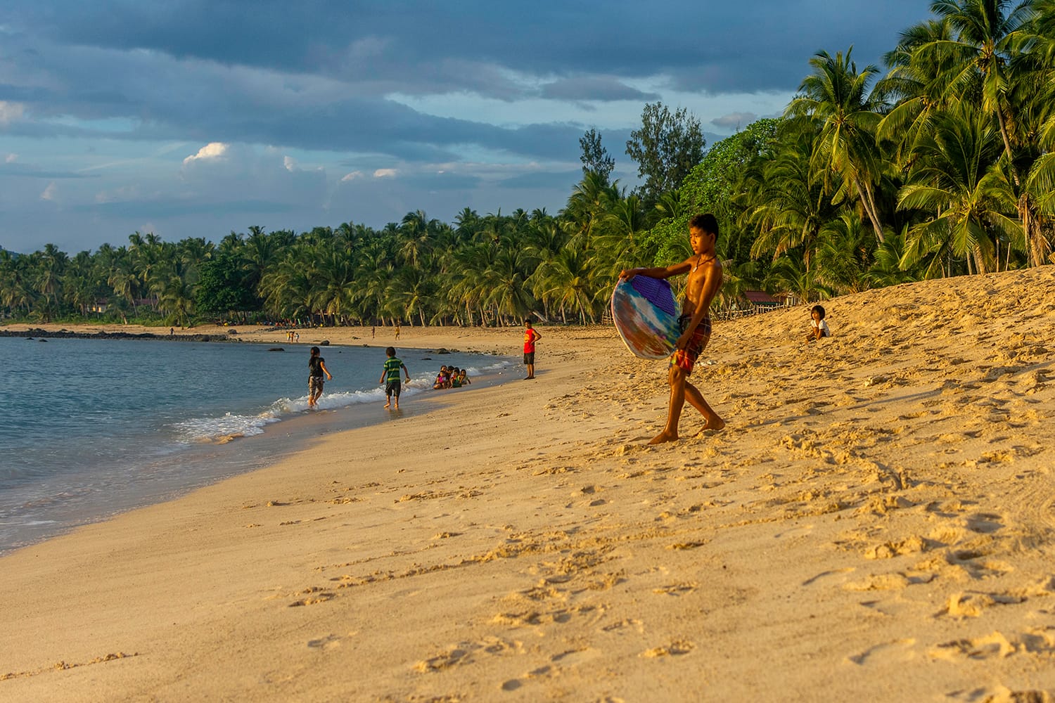 Boy surfing in Dahican, Mati, Davao Oriental, Philippines