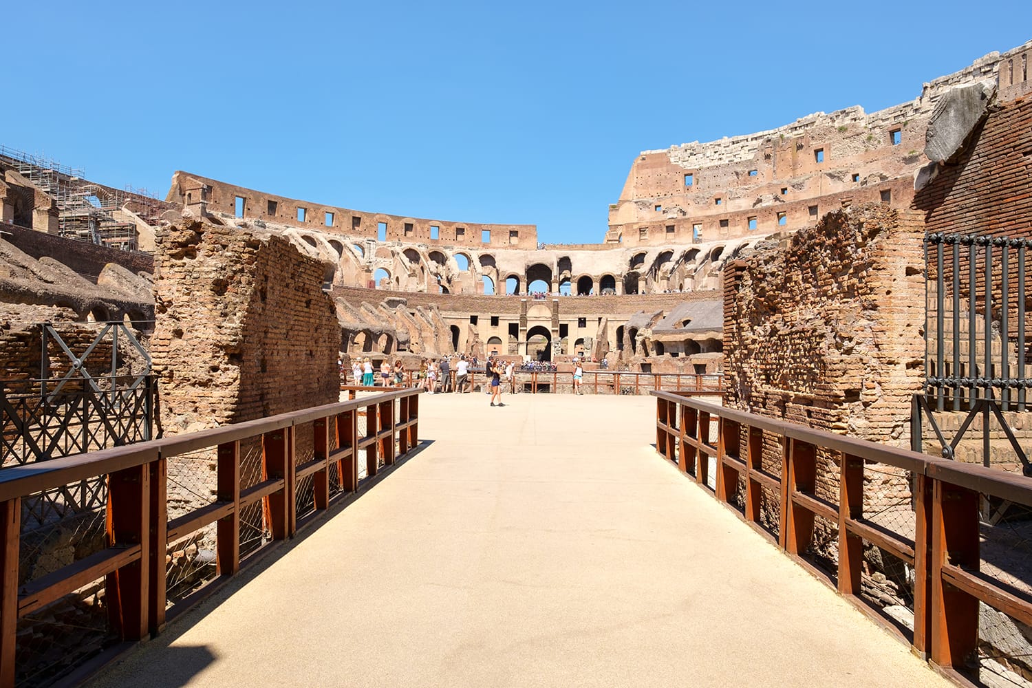 Tourists at the ruins of the Colosseum in Rome, Italy