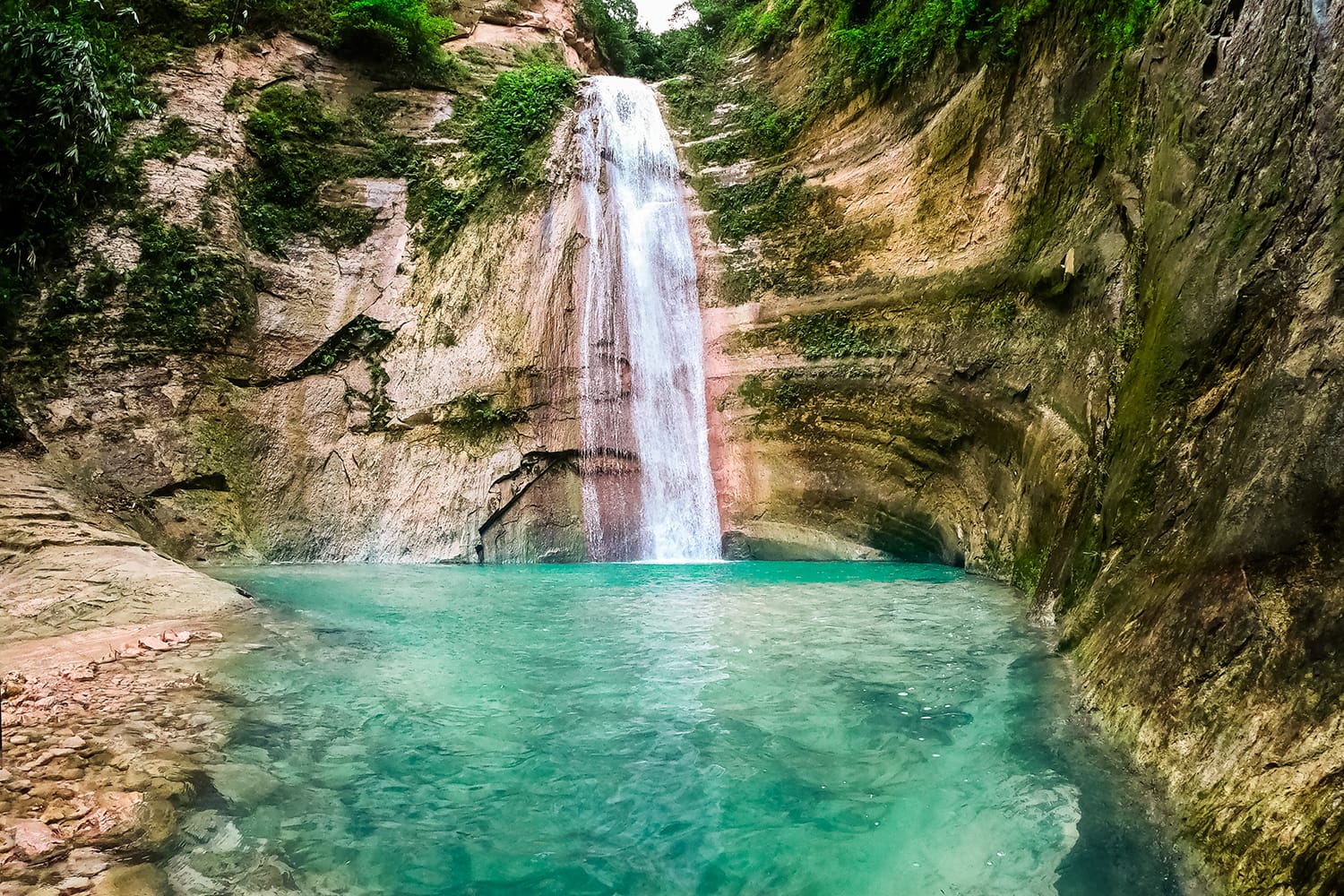 Dao waterfalls in a mountain gorge in the tropical jungle of the Philippines, Cebu.