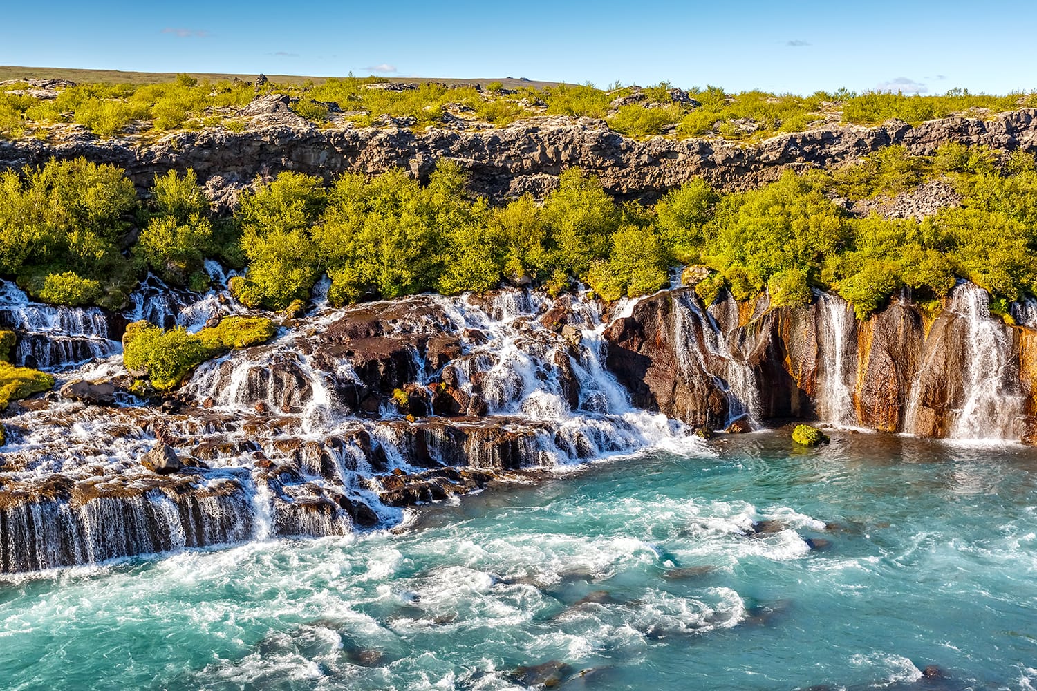 View of Hraunfossar waterfall in Iceland at sundown