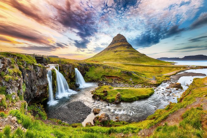 Fantastic view on Kirkjufellsfoss waterfall near Kirkjufell mountain at sunset. Location: Kirkjufellsfoss, Grundarfjordurn, Iceland