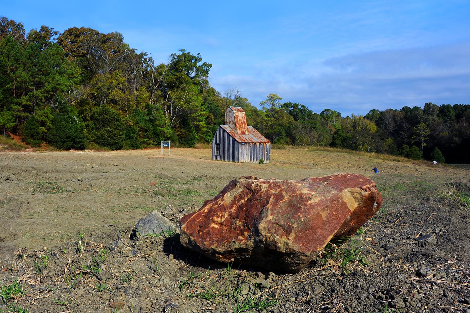 Large rock fronts the Ozark Diamond Mine's diamond mine shaft at the Crater of Diamonds State Park in Arkansas.
