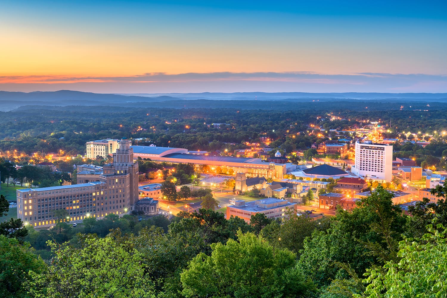 Hot Springs, Arkansas, USA town skyline from above at dawn.