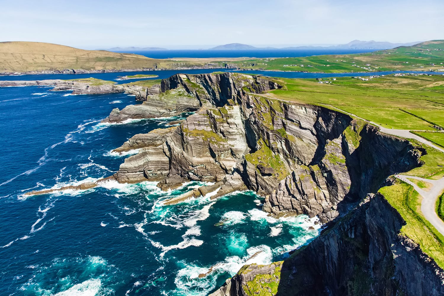 Amazing wave lashed Kerry Cliffs, widely accepted as the most spectacular cliffs in County Kerry, Ireland. Tourist attractions on famous Ring of Kerry route.
