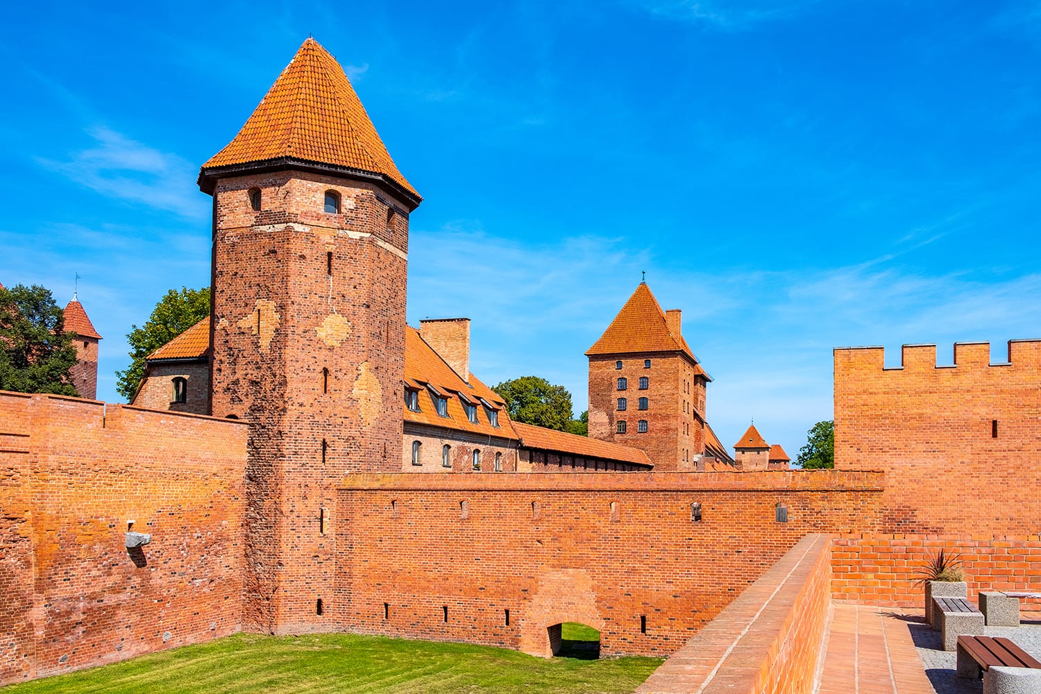 Panoramic view of the medieval Teutonic Order Castle in Malbork, Poland - external defense walls, towers moat and keeps