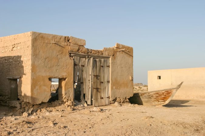 An old shed and fishing boat in Al Jazirat Al Hamra