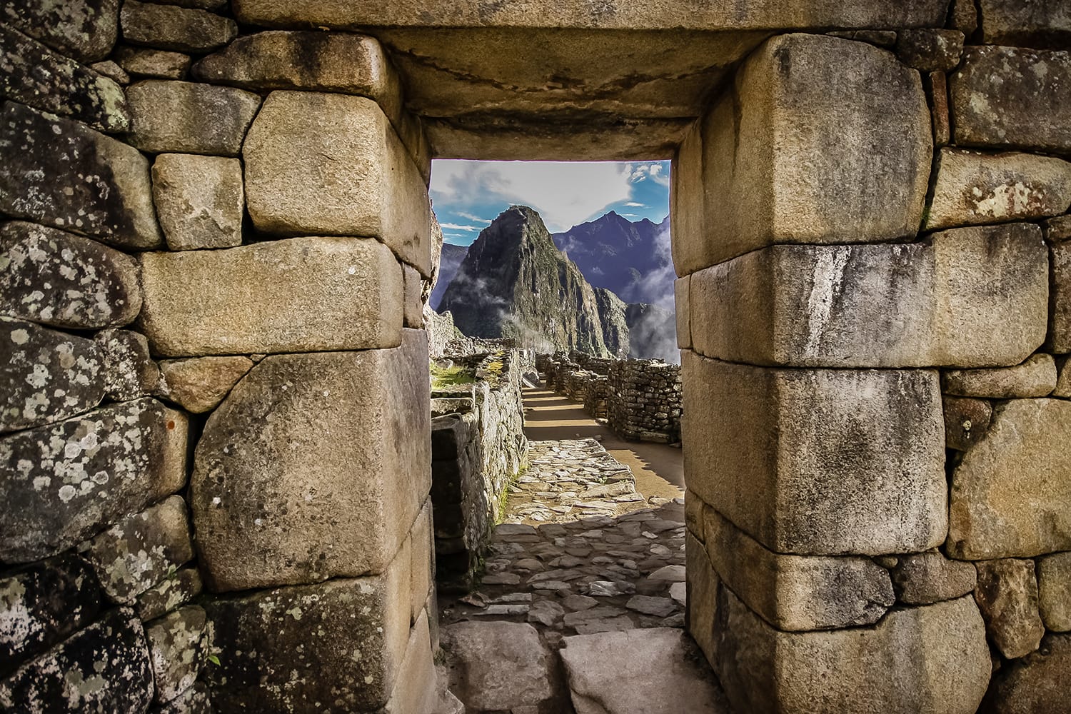 Doorway at Machu Picchu frames a view of Huayna Picchu in Machu Picchu