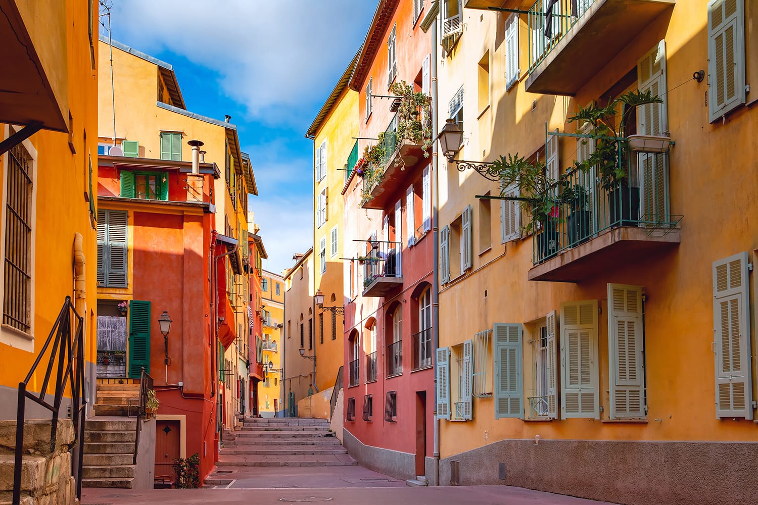 Sunny colorful historical houses in Old Town of Nice, French Riviera, Cote d'Azur, France