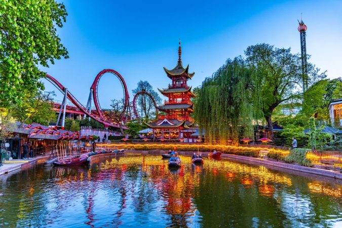 Pond with rowing boats at Tivoli amusement park in Copenhagen, Denmark