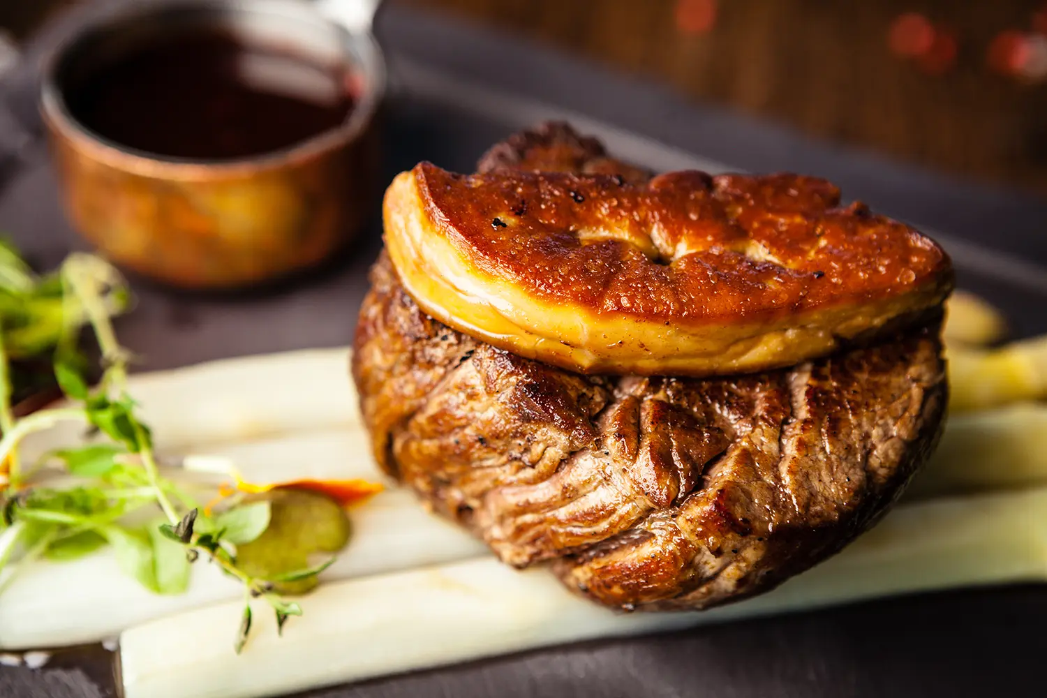 Tournedos Rossini. Foie gras, Black Angus beef tenderloin, white asparagus, red wine sauce.