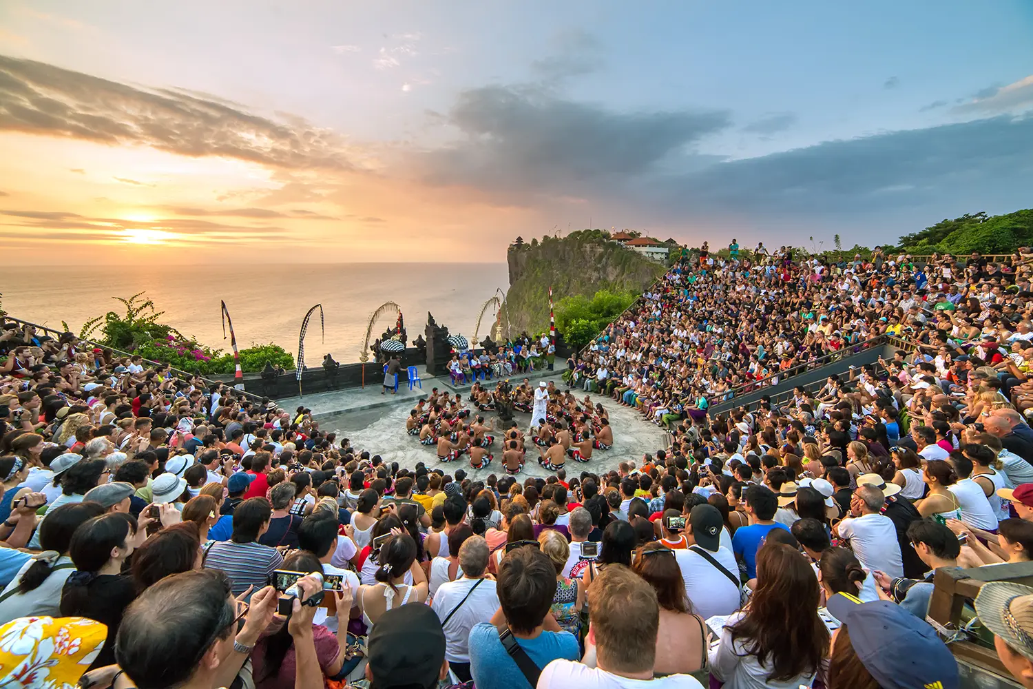 Tourists watch traditional Balinese Kecak Dance at Uluwatu Temple on Bali, Indonesia