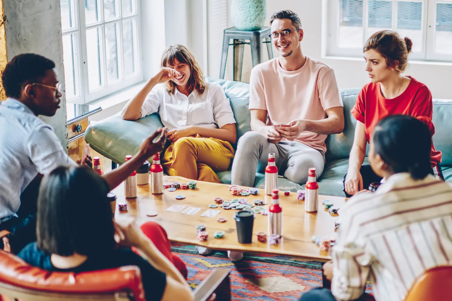Diverse group of travelers socializing at a hostel