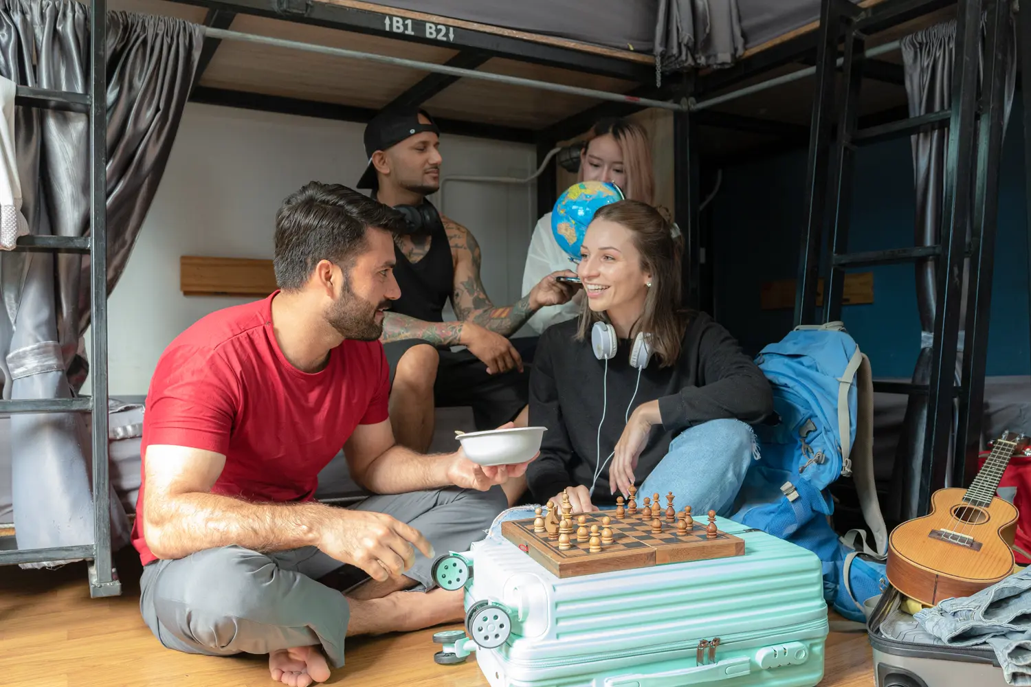 Groups of travelers of various nationalities stay in hostels, travelers play fun games, travel trips.