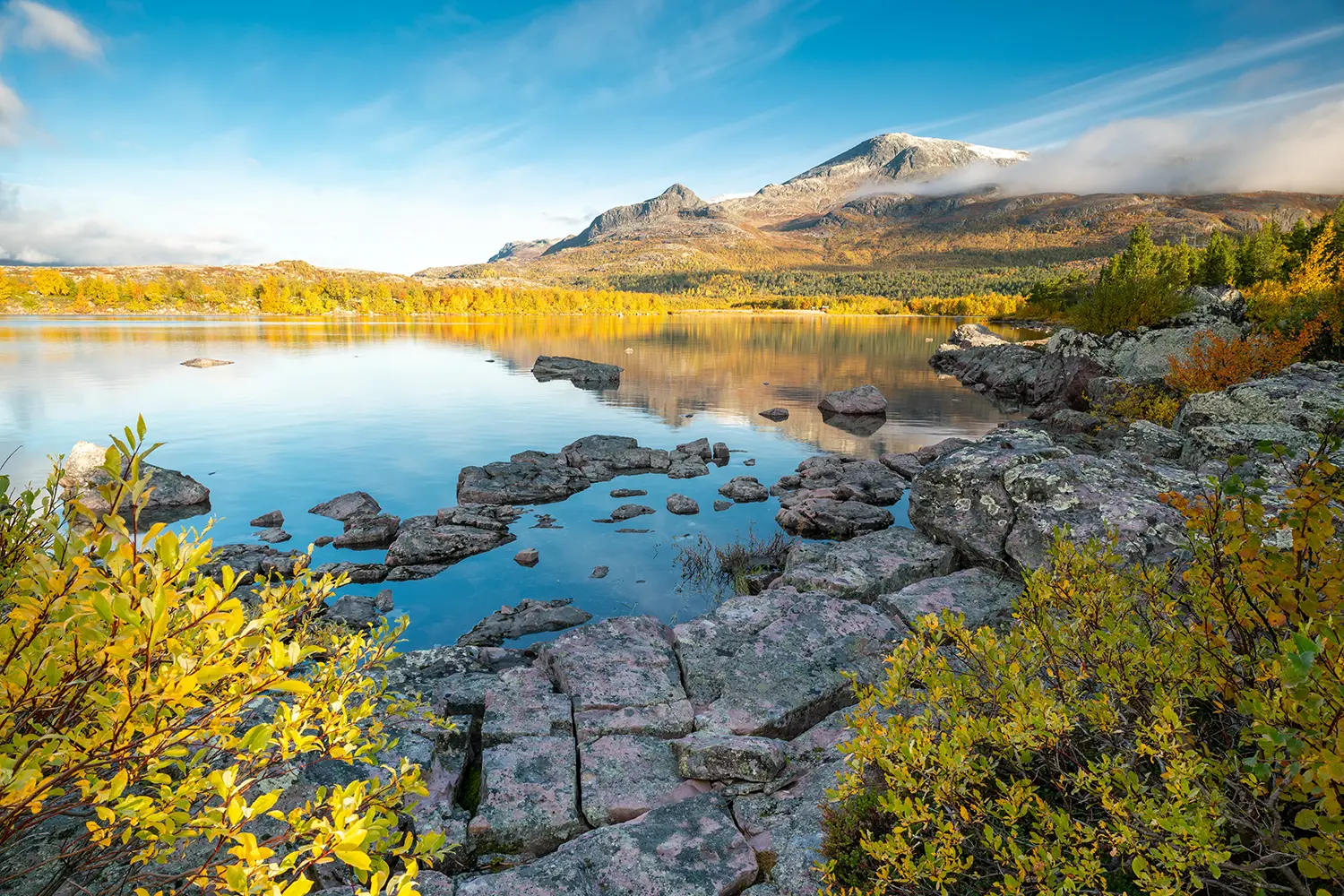 Nieras mountain reflects in Lulealven dam in Stora Sjofallet national park, Sweden.