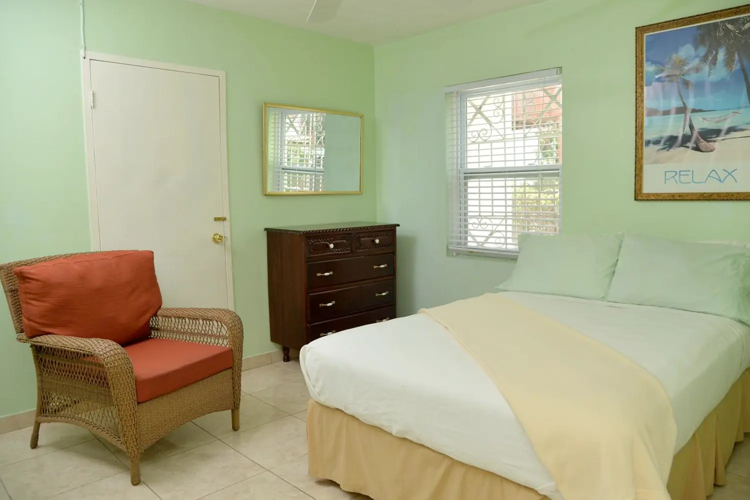 a bed and chair in a room at Castle Vue B&B