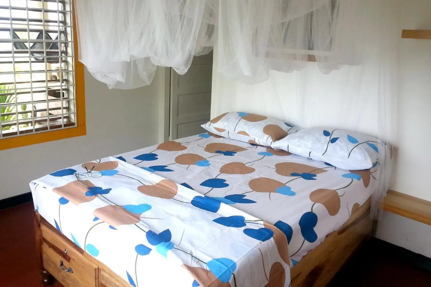 A bed in a room at Germaican Hostel