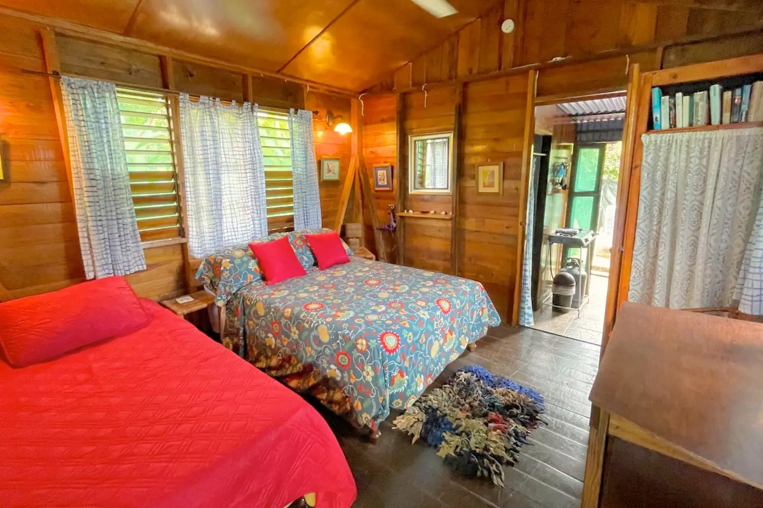 two beds inside a cottage at Judy House