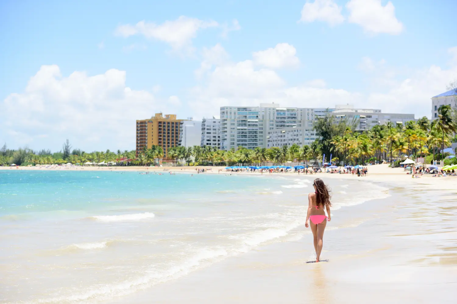 People on Isla Verde resort beach in San Juan, Puerto Rico