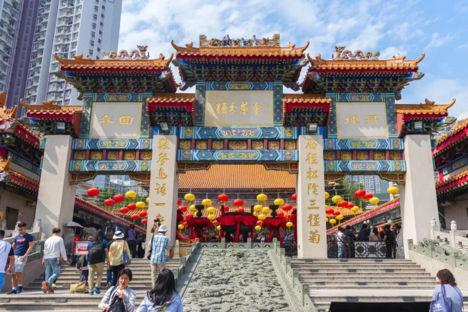 Tourist visiting Wong Tai Sin Temple in Kowloon in Hong Kong