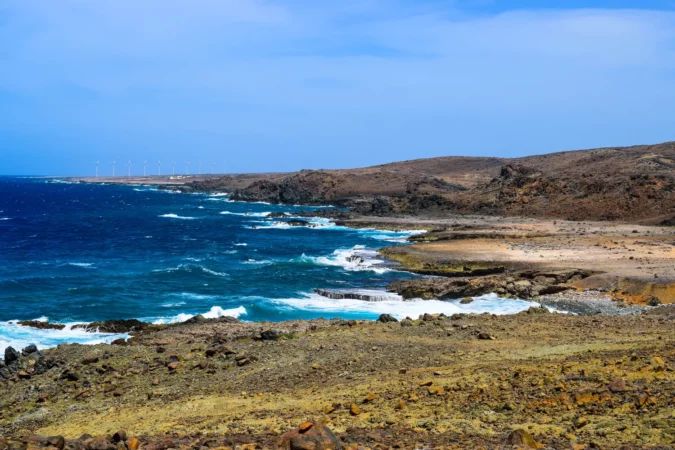 Arikok National Park on the island of Aruba in the Caribbean Sea with deserts and ocean waves on the rocky coast