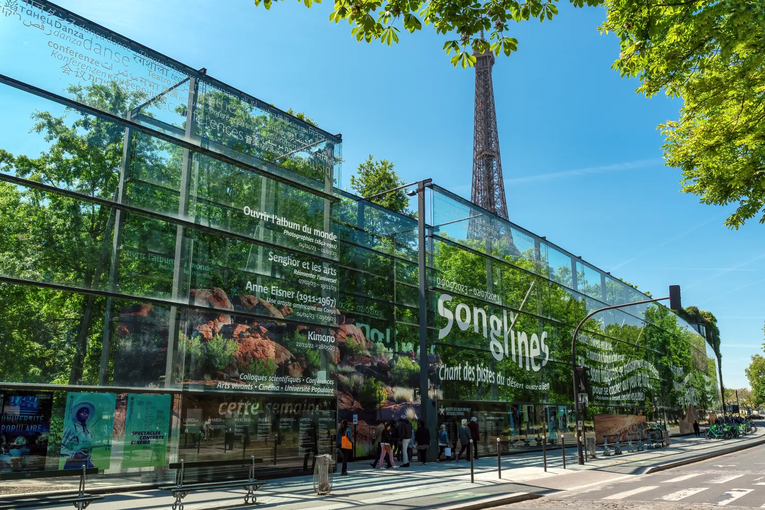 Entrance to the Quai Branly Jacques Chirac Museum in Paris with the Eiffel tower in the background