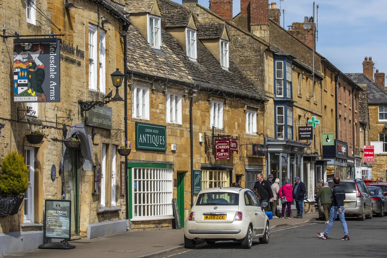 The High Street in the beautiful market town of Moreton-in-Marsh, located in the Cotswolds in Gloucestershire, UK.