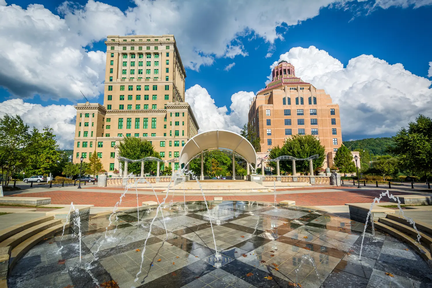 Fountains at Park Square Park and buildings in downtown Asheville, NC