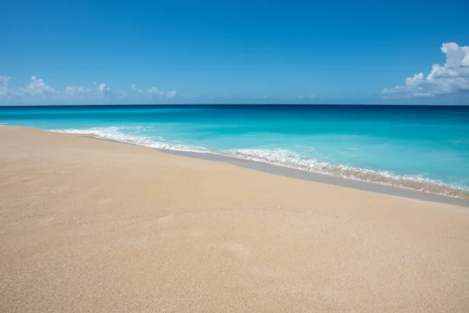 Stunning turquoise Caribbean Sea waters and sandy beach on a sunny day at Sandy Point on St. Croix in the US Virgin Islands