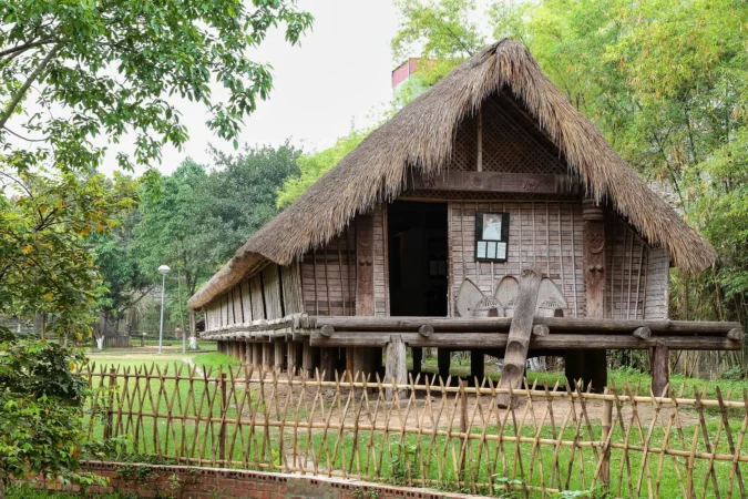 Replica of a traditional tribal house at the Vietnam Museum of Ethnology in Hanoi, Vietnam
