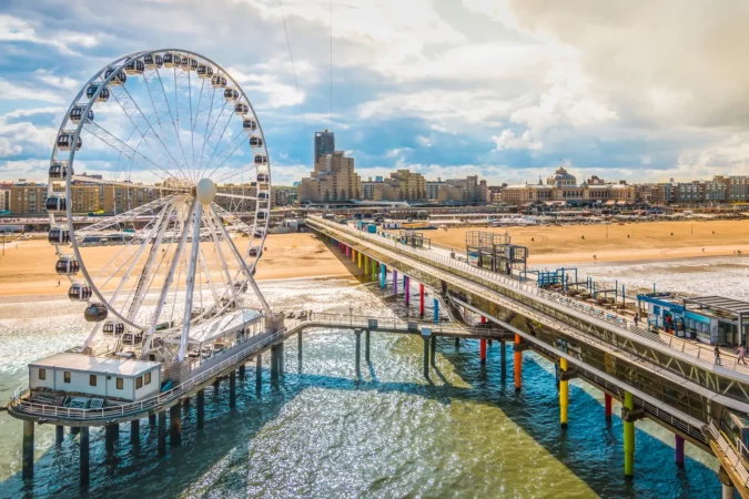 Scheveningen, The Hague, The Netherlands. Ferris wheel and pier at the beach.