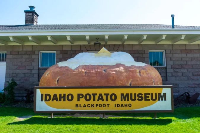 daho Potato Museum sign and giant baked potato at a museum devoted to the potato history and industry in Blackfoot, Idaho, USA