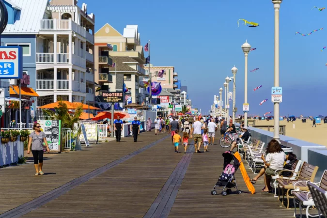 People walk on the Ocean City Boardwalk in Maryland